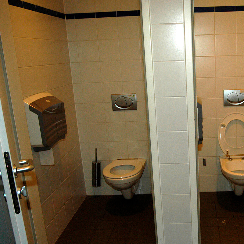 Lockable toilet roll dispenser - Public-Toilets-With-Open-Doors-Tiled-Room-With-Lockable-Doors